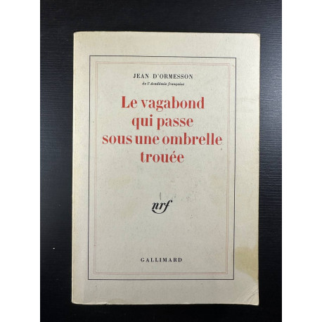 Le vagabond qui passe sous une ombrelle trouée