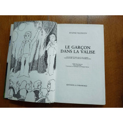 Le garçon dans la valise
